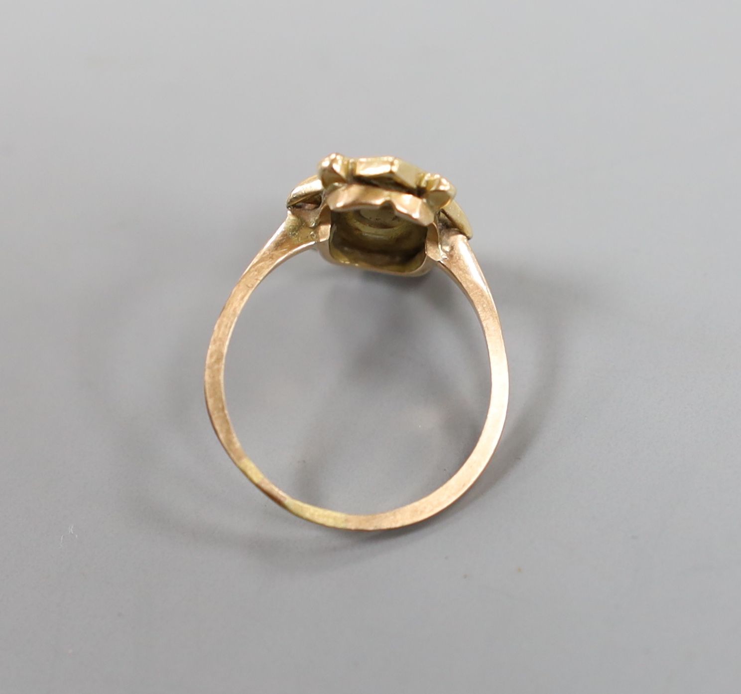 A 19th century yellow metal, garnet and four stone rose cut diamond set dress ring, size P/Q, gross 2.4 grams.